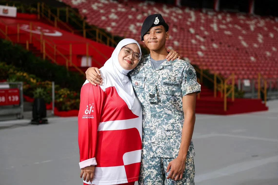 Among the civilian contingents are mother-and-son duo, Siti Radziah Zainal Abidin and Ari Wafiy Muhammad Mahfudz.