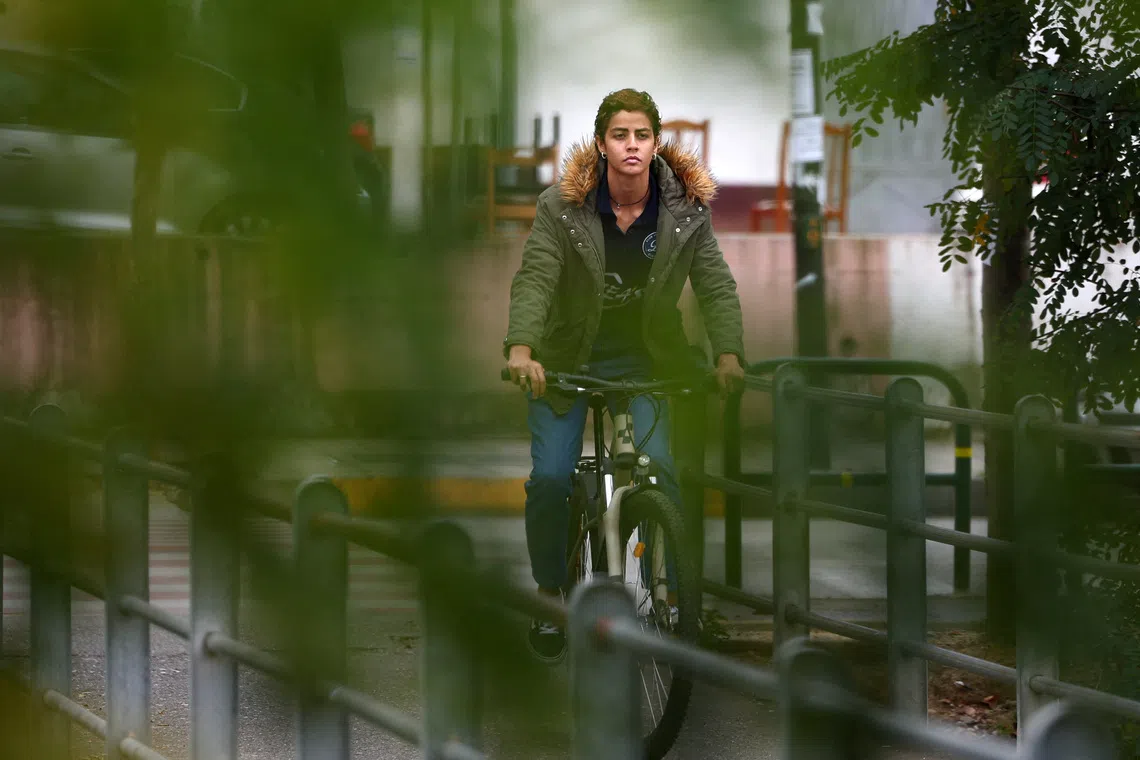 Brazilian volleyball player Nayara Ferreira rides her bicycle after she was banned from playing for the Albanian Volleyball Federation for not taking a gender test, in Tirana, Albania, November 3, 2025. REUTERS/Florion Goga