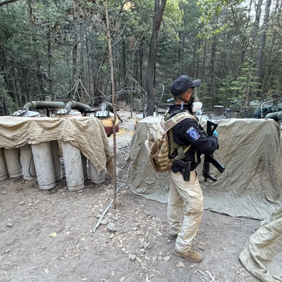 An investigative agent stands inside what the Attorney General's Office of Chihuahua said was a clandestine methamphetamine processing laboratory discovered during an operation by Mexican authorities in a mountainous area near Guachochi, in Chihuahua state, Mexico, in this handout photo distributed on April 18, 2026. Attorney General's Office of Chihuahua/Handout via REUTERS