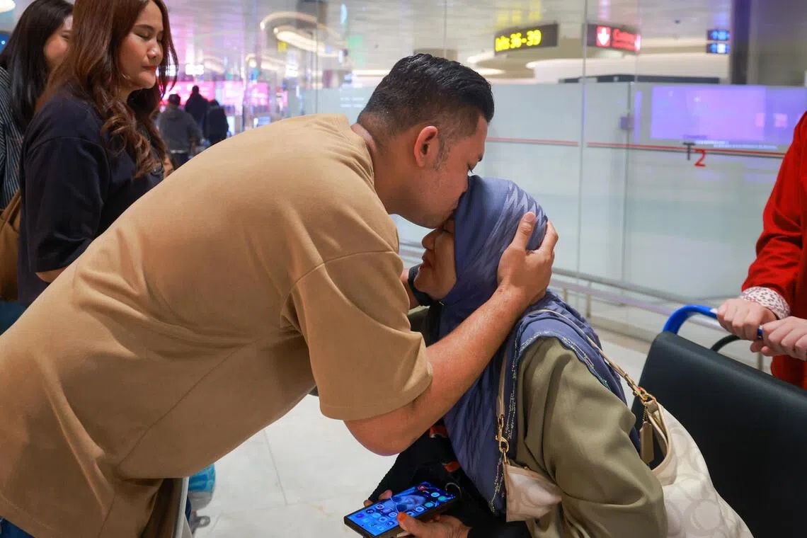 ST20260908_202658000559/bdindo08/Jason Quah

Mohammad Fauzi Hussin, 43, greeting his mother Norsiah Hamid, 67 as she returns to Singapore on relief flight SQ 9885, at Changi Airport Terminal 2 on Sep 8, 2026. ST PHOTO: JASON QUAH