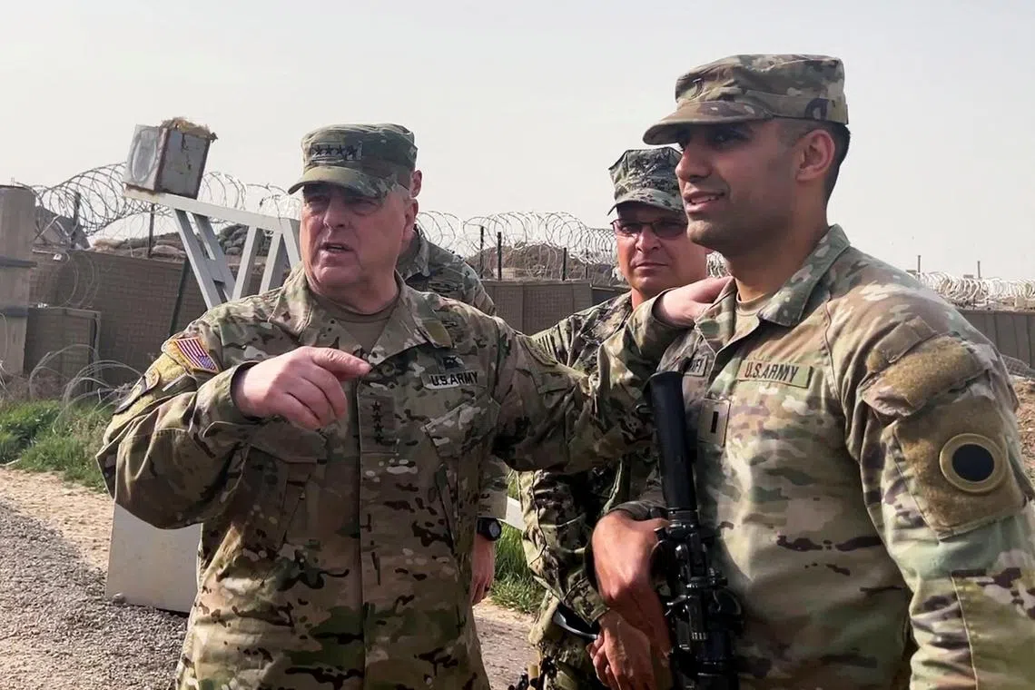 US General Mark Milley (left) makes an unannounced visit to US forces in Syria, on March 4, 2023.