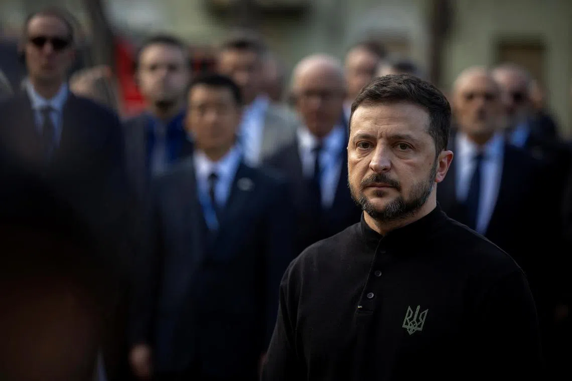 Ukrainian President Volodymyr Zelensky visiting the site of a Russian missile strike in Kyiv, where 12 people died, on April 25.