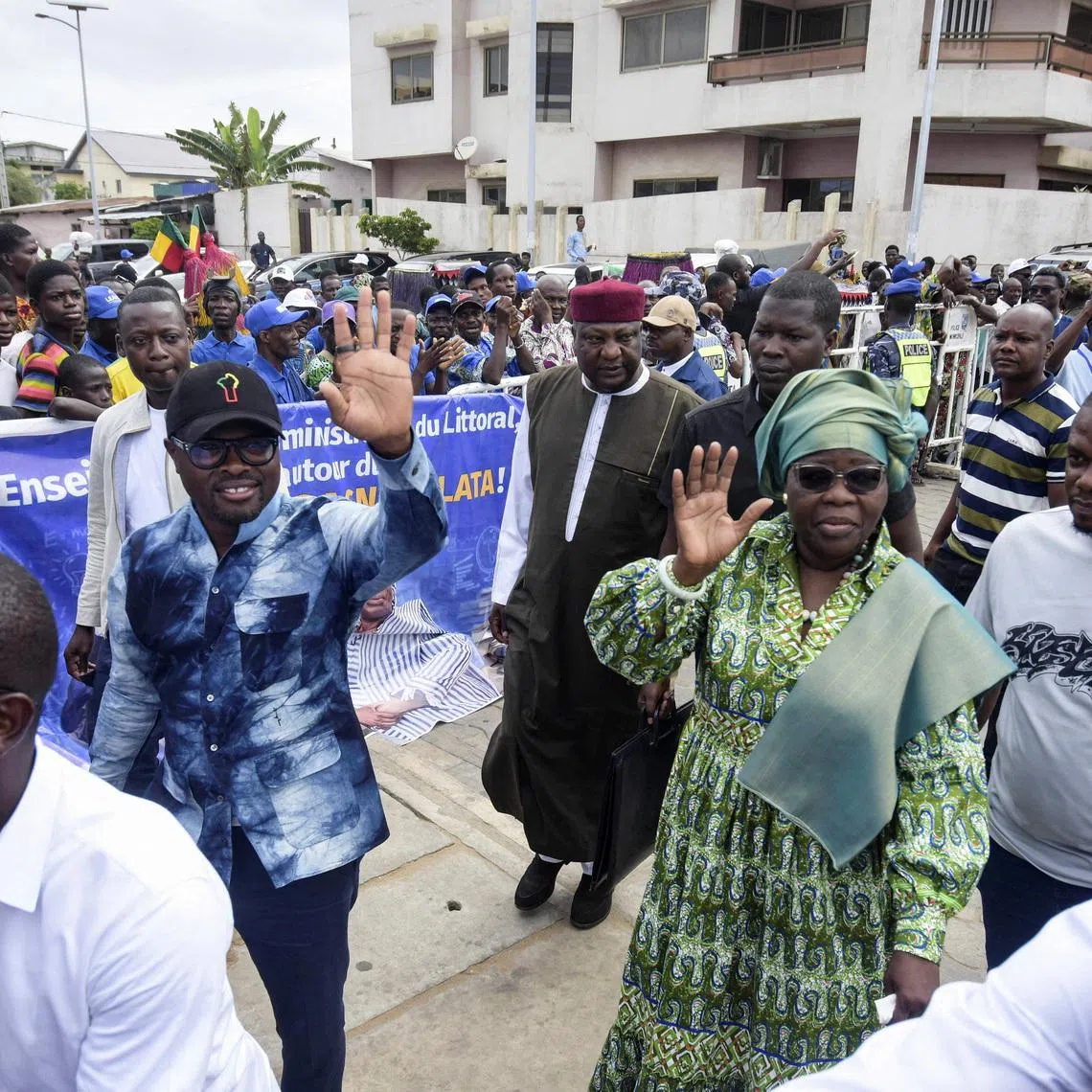 Romuald Wadagni, Benin's finance minister and the ruling party candidate for the presidential election, waves alongside running mate and Vice President of Benin, Mariam Chabi Talata, at a campaign rally ahead of the presidential election scheduled for April 12, in Cotonou, Benin, April 10, 2026.   REUTERS/Charles Placide Tossou