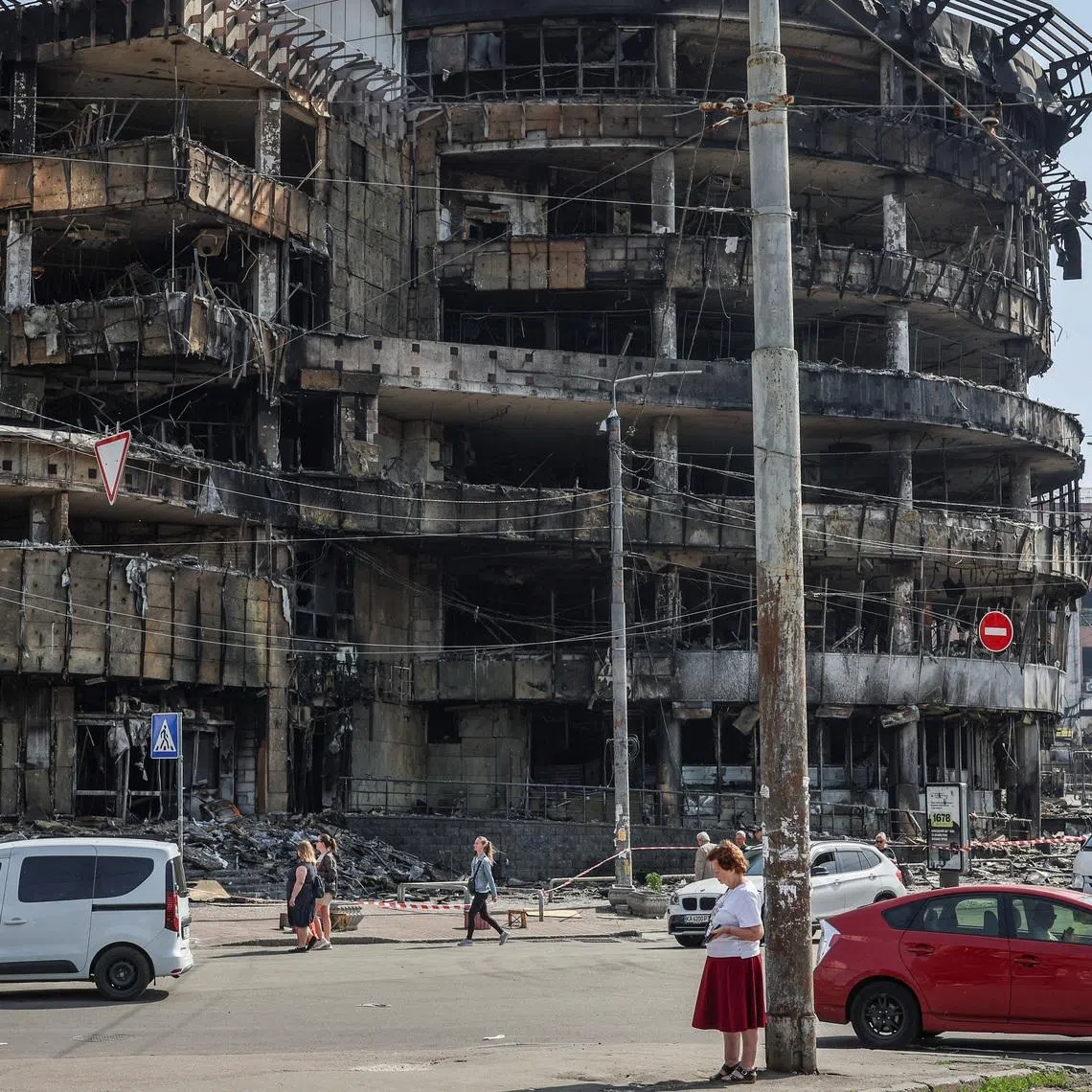 A view shows a street with a destroyed shopping mall, which was hit during yesterday's Russian missile and drone attack, amid Russia's attack on Ukraine, in Kyiv, Ukraine, May 25, 2026. REUTERS/Alina Smutko