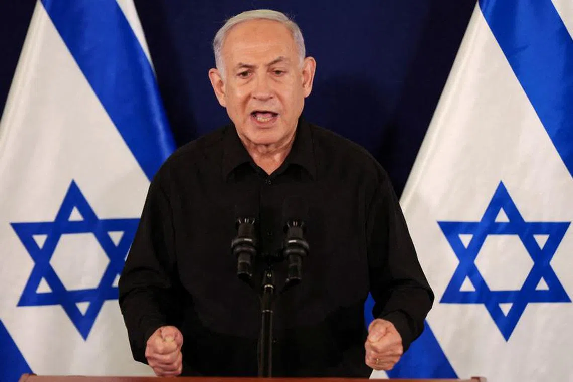 Israeli Prime Minister Benjamin Netanyahu speaks during a press conference with Defense Minister Yoav Gallant and Cabinet Minister Benny Gantz in the Kirya military base in Tel Aviv , Israel , 28 October  2023.    ABIR SULTAN POOL/Pool via REUTERS/File Photo