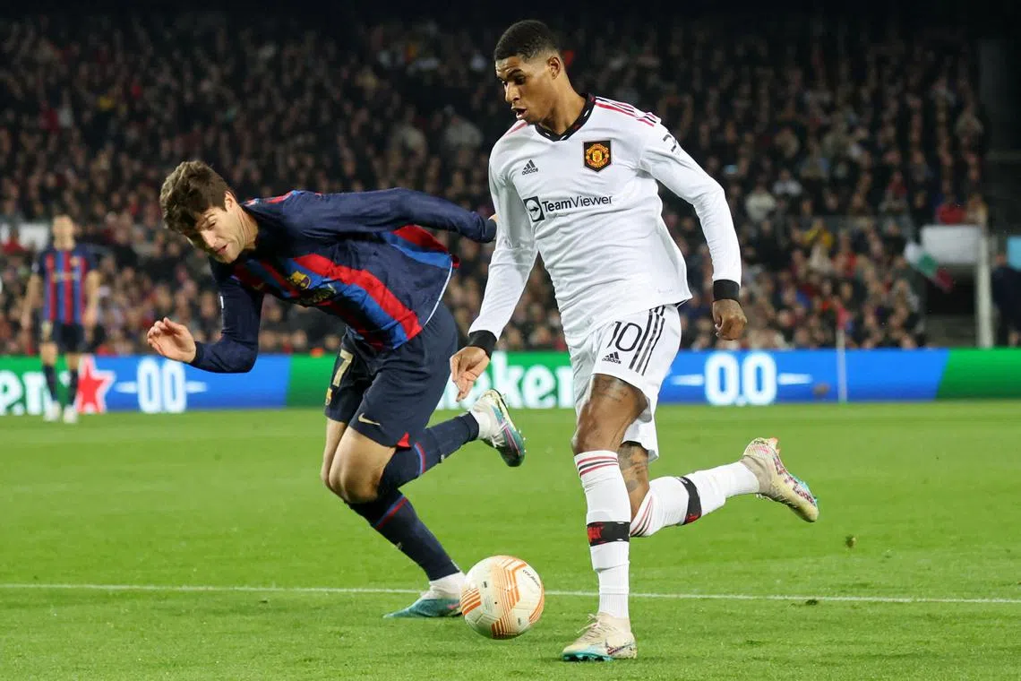 Manchester United's Marcus Rashford bringing the ball forward as Barcelona's Marcos Alonso tries to keep up in their 2-2 Europa League draw on Thursday.