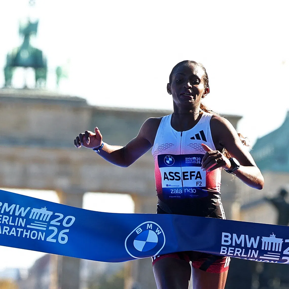 Athletics - Berlin Marathon - Berlin, Germany - September 27, 2026 Ethiopia's Tigst Assefa crosses the line to win the women's elite race REUTERS/Lisi Niesner