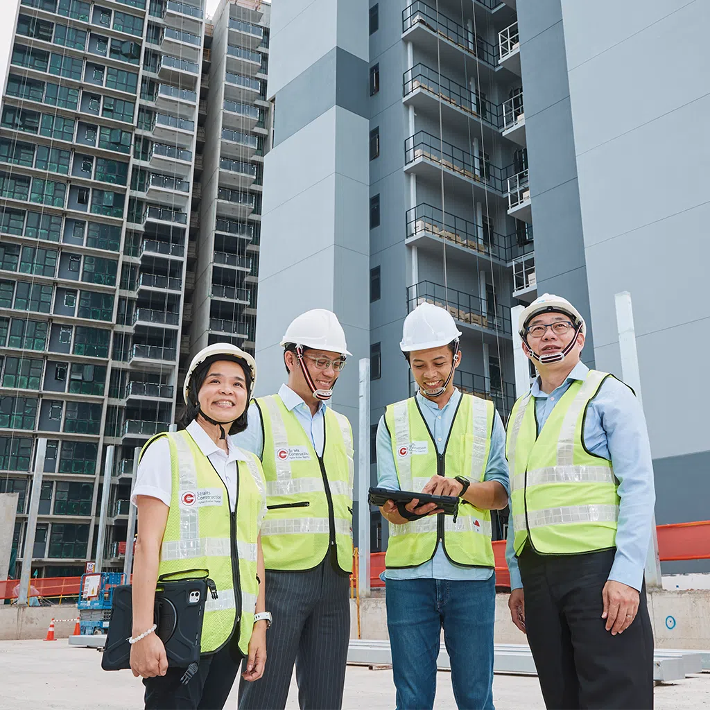 corinne lim of straits construction singapore, koon wai leong of hoi hup realty, ng sin yong of addp architects, and gwee siong mong of ronnie & koh consultants posing together. the four professionals represent the firms that collaborated on novo place, an executive condominium in tengah, and were early adopters of the corenet x platform