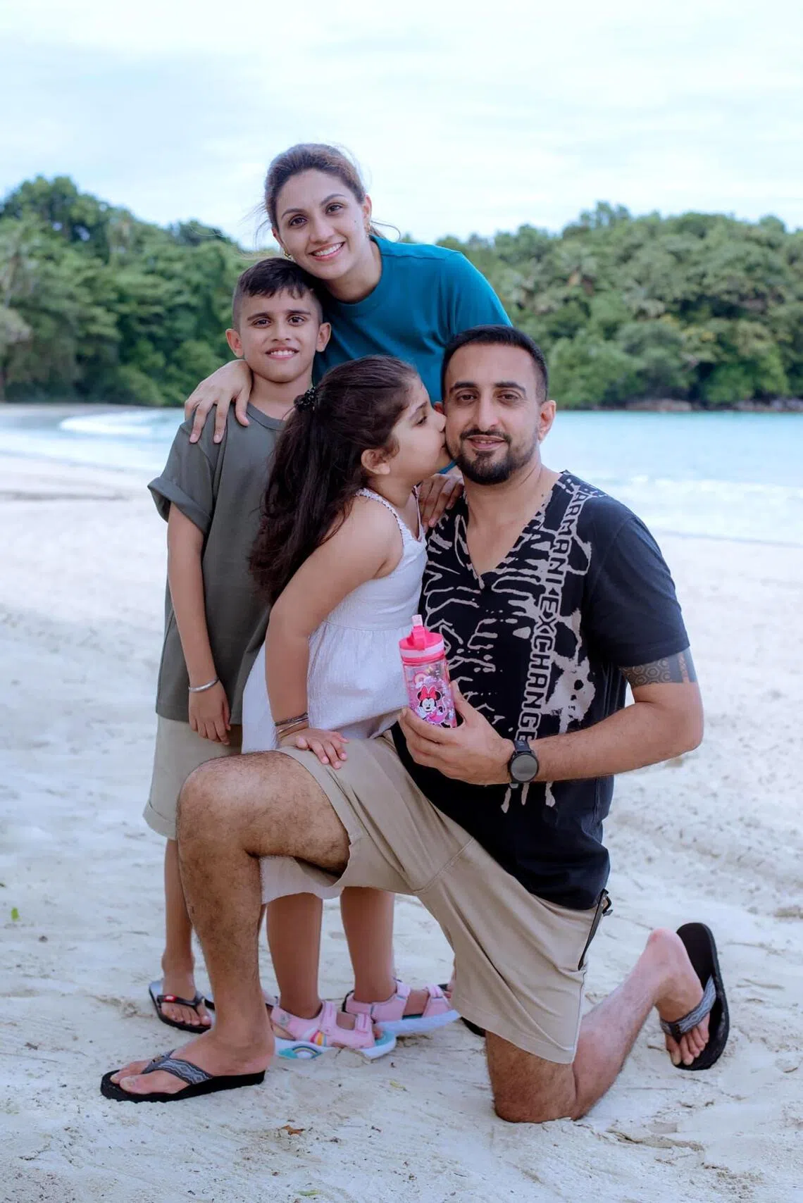 Mr Kevinder Singh with his wife, Ms Shohiniy Kaur, and their two kids Mikhel Singh and Mishka Kaur.