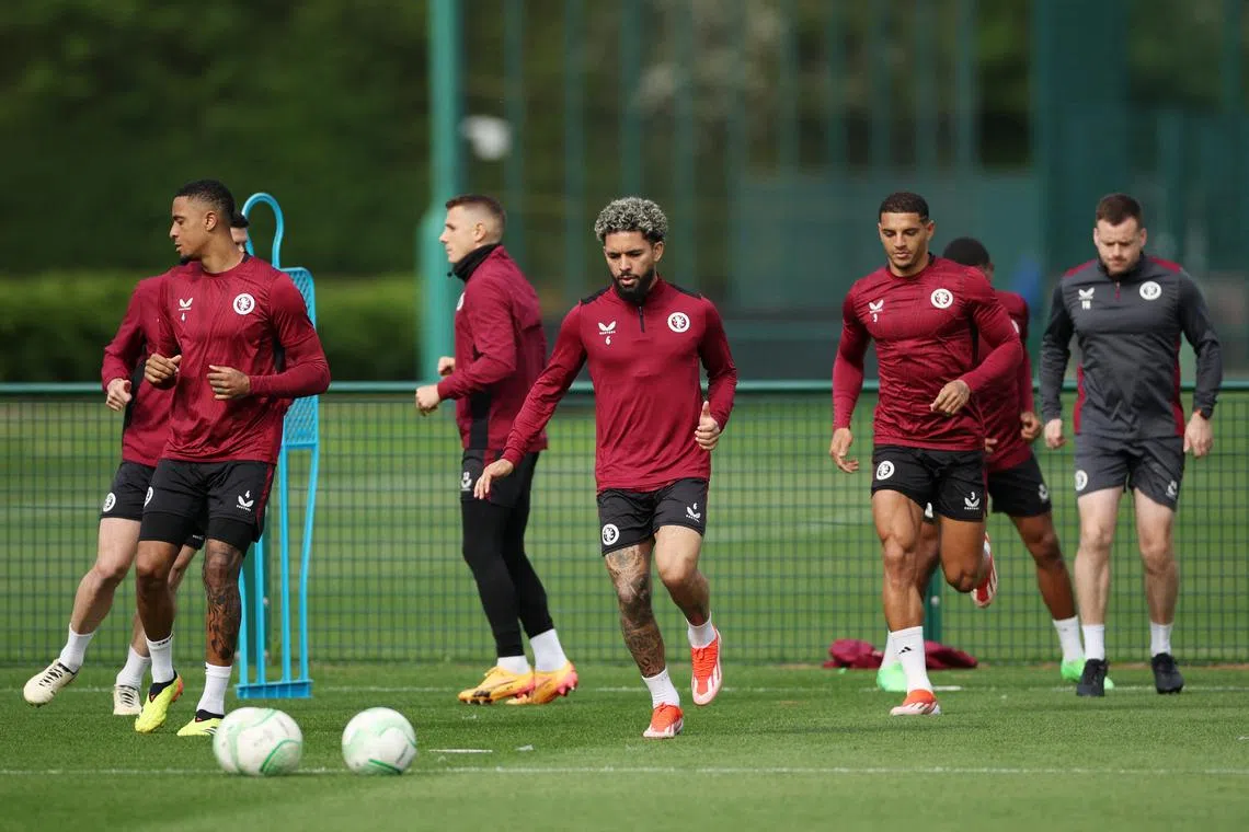 Soccer Football - Europa Conference League - Aston Villa Training - Bodymoor Heath Training Ground, Bodymoor Heath, Britain - May 8, 2024 Aston Villa's Douglas Luiz with Diego Carlos and teammates during training Action Images via Reuters/Andrew Boyers/File Photo