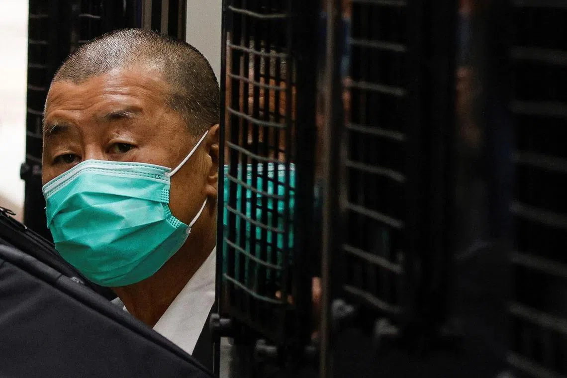 FILE PHOTO: Media mogul Jimmy Lai, founder of Apple Daily, arrives at the Court of Final Appeal, in a prison van in Hong Kong, China February 9, 2021. REUTERS/Tyrone Siu/File Photo