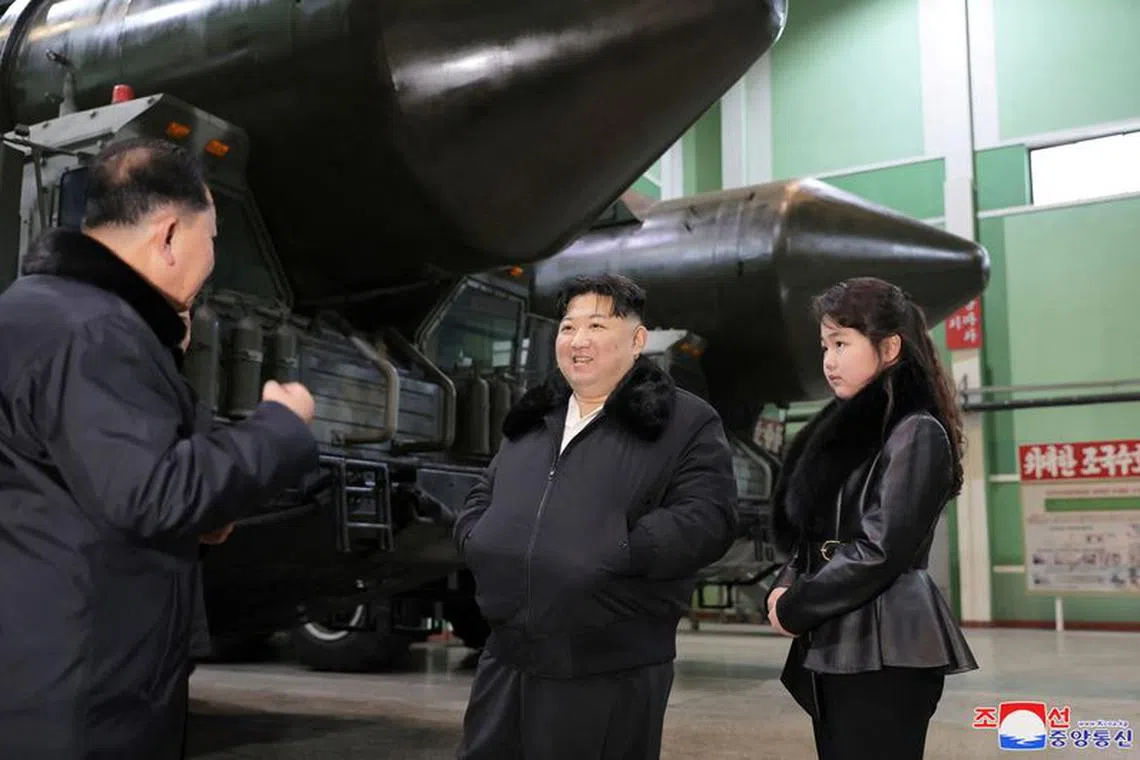 North Korean leader Kim Jong Un, accompanied by his daughter Kim Ju Ae, visits a military vehicle production plant, in this picture released by North Korea's Korean Central News Agency (KCNA) on January 5, 2024.  KCNA via REUTERS