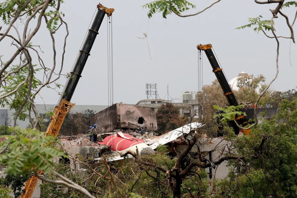 FILE PHOTO: Members of Indian Army's engineering arm prepare to remove the wreckage of an Air India aircraft, bound for London's Gatwick Airport, which crashed during take-off from an airport in Ahmedabad, India June 14, 2025. REUTERS/Amit Dave/File Photo