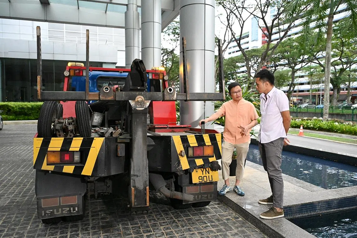 Owner of Gao Express Towing Service Jim Koh operating his tow truck for ST senior transport correspondent Lee Nian Tjoe.