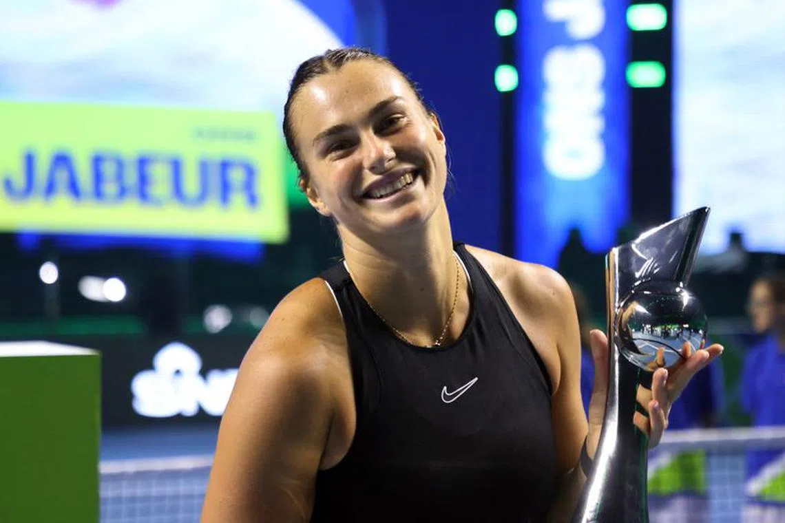 Tennis - Exhibition Match - Aryna Sabalenka v Ons Jabeur - Riyadh, Saudi Arabia - December 26, 2023 Belarus' Aryna Sabalenka poses with a trophy after winning her exhibition match against Tunisia's Ons Jabeur REUTERS/Ahmed Yosri/File Photo