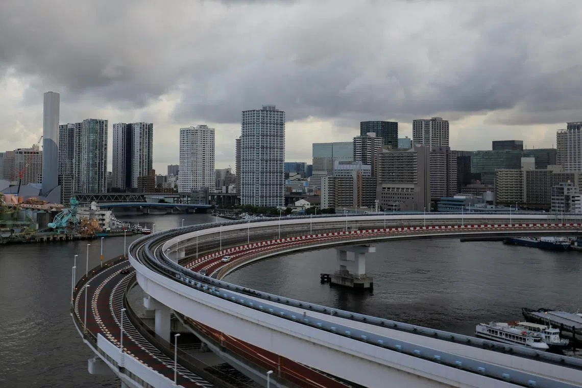 FILE PHOTO: A view of the Tokyo skyline is seen through the window of a bus in Tokyo, Japan, August 2, 2021. REUTERS/Amr Abdallah Dalsh/File Photo