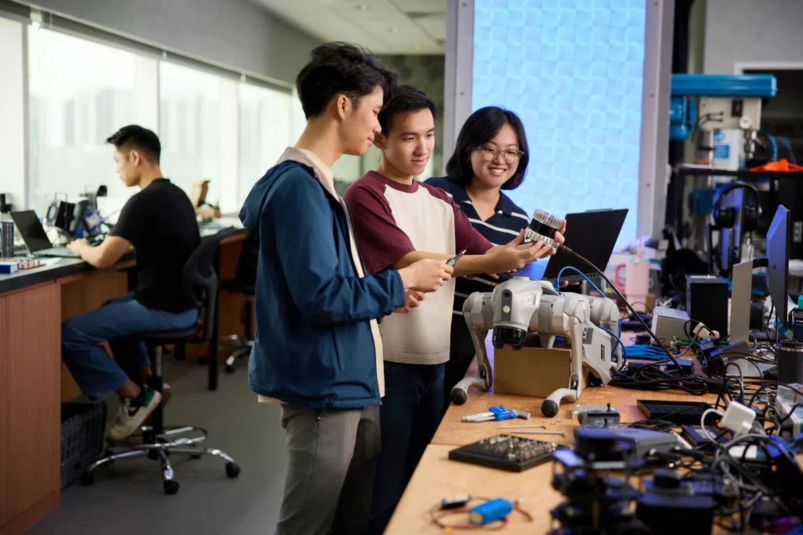 3i engineer Joseph Wong with teammates at HTX’s Robotics, Automation and Unmanned Systems Centre of Expertise