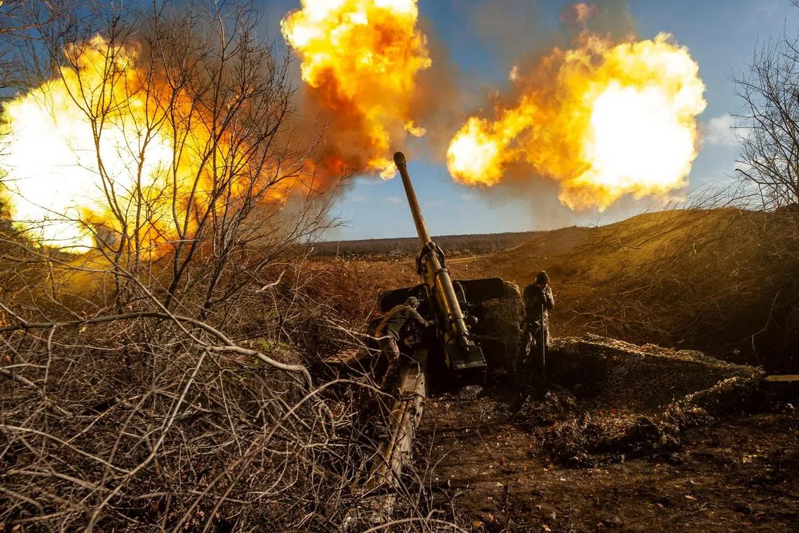 Ukrainian servicemen fire a 130 mm towed field gun M-46 on a frontline near Soledar, Donetsk region, Ukraine, on Nov 10, 2022. 