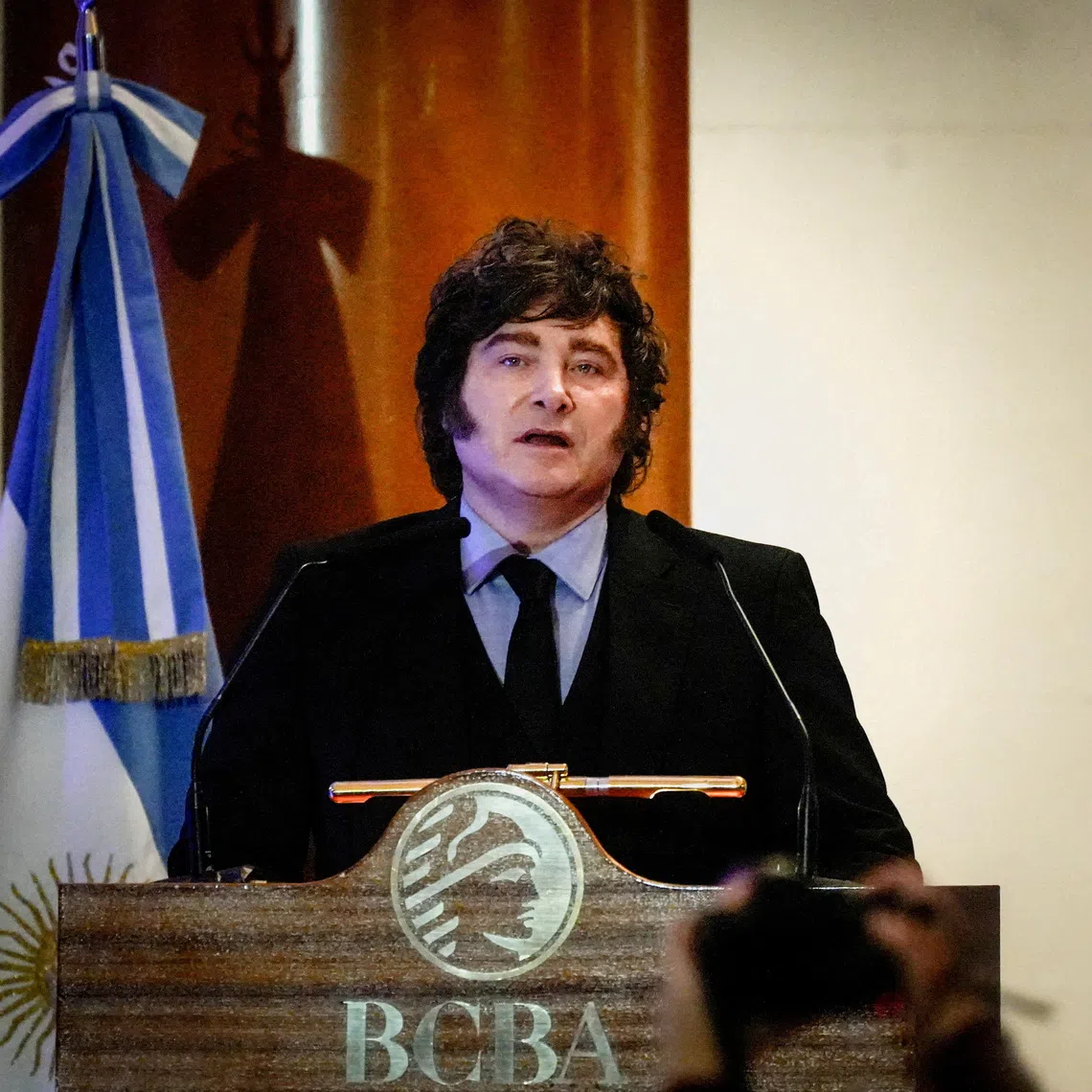 FILE PHOTO: Argentine President Javier Milei waves during a ceremony commemorating the 172nd anniversary of the Buenos Aires Stock Exchange in Buenos Aires, Argentina, July 16, 2026. REUTERS/Mariana Nedelcu/File Photo