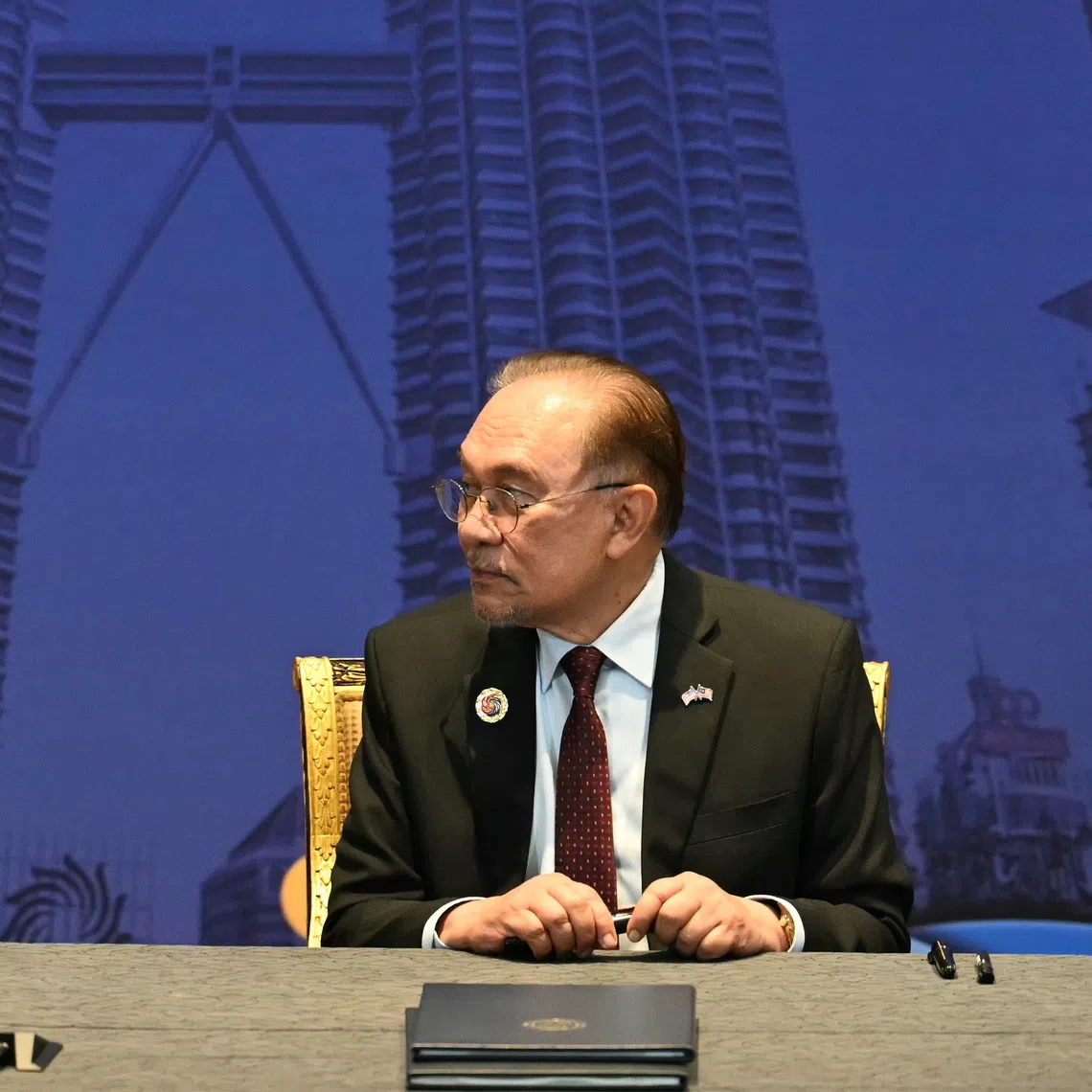 Malaysia's Prime Minister Anwar Ibrahim (right) os a bilateral meeting with US President Donald Trump on the sidelines of the Asean Summit in Kuala Lumpur on Oct 26.