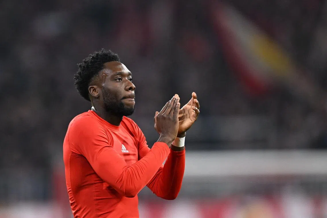 Soccer Football - UEFA Champions League - Bayern Munich v Sporting CP - Allianz Arena, Munich, Germany - December 9, 2025 Bayern Munich's Alphonso Davies celebrates after the match REUTERS/Angelika Warmuth