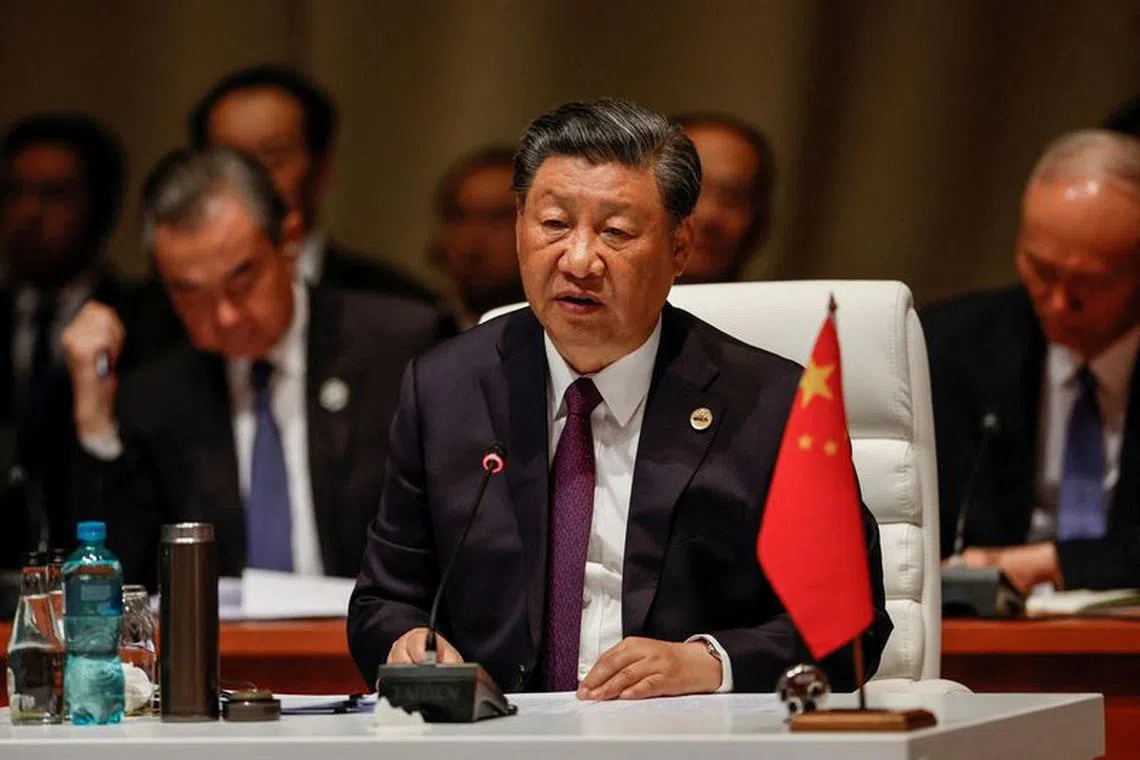 FILE PHOTO: President of China Xi Jinping attends the plenary session during the 2023 BRICS Summit at the Sandton Convention Centre in Johannesburg, South Africa on August 23, 2023. GIANLUIGI GUERCIA/Pool via REUTERS/File Photo