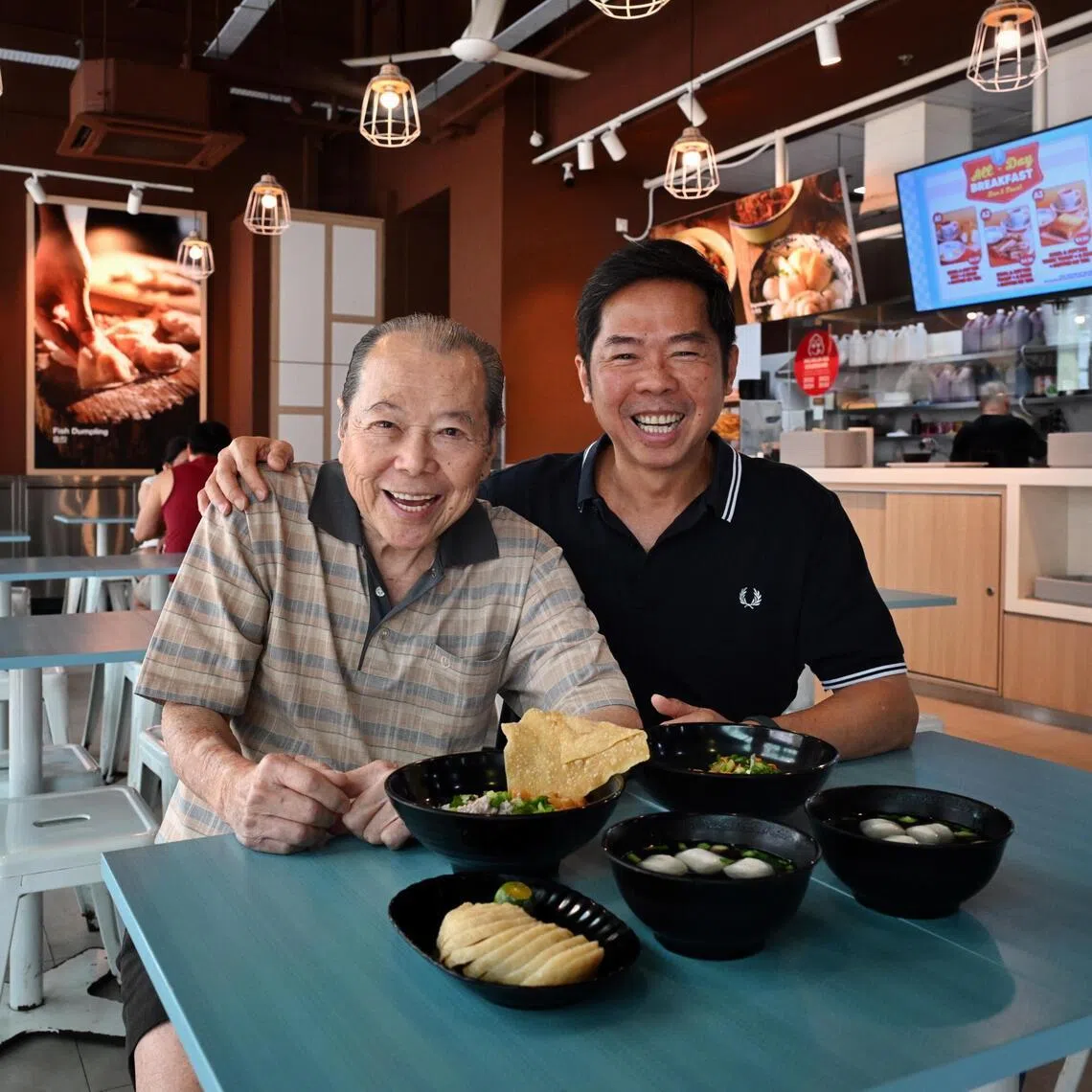 Mr Lim Lee Seng and his son, Mr Eddie Lim, at LiXin Teochew Fishball Noodles at ESR BizPark@ Chai Chee outlet.