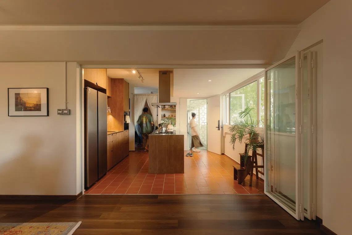 This sunny, low-rise HDB flat in Geylang East is framed by greenery.