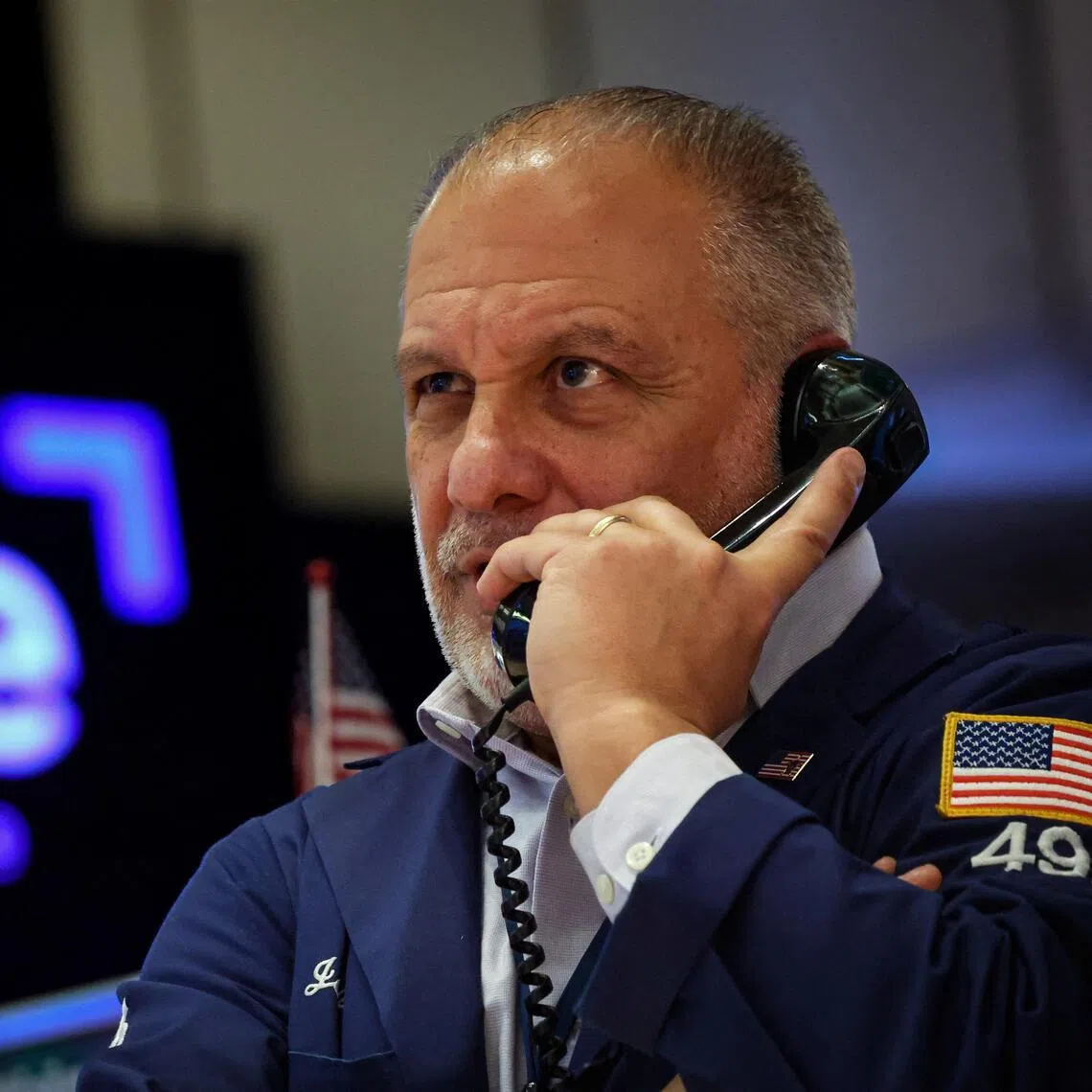 A trader working on the floor of the New York Stock Exchange, in New York City, on Jan 15.