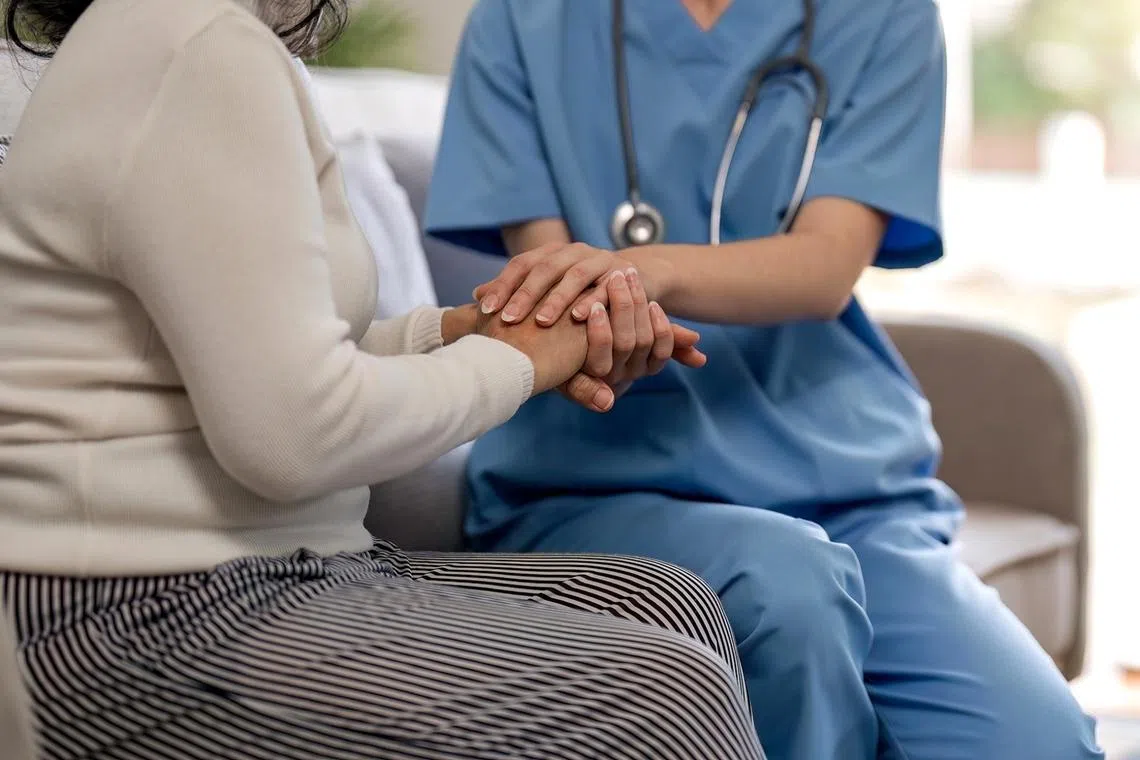 Helpless in a hospital chair, she gained strength by trusting others and letting go