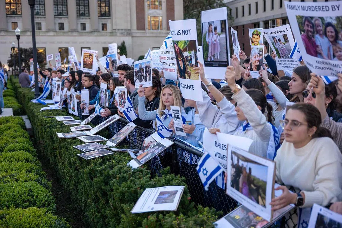 Columbia University students participating in a rally and vigil in support of Israel in response to a neighbouring student rally in support of Palestine at the university on Oct 12 in New York City. 