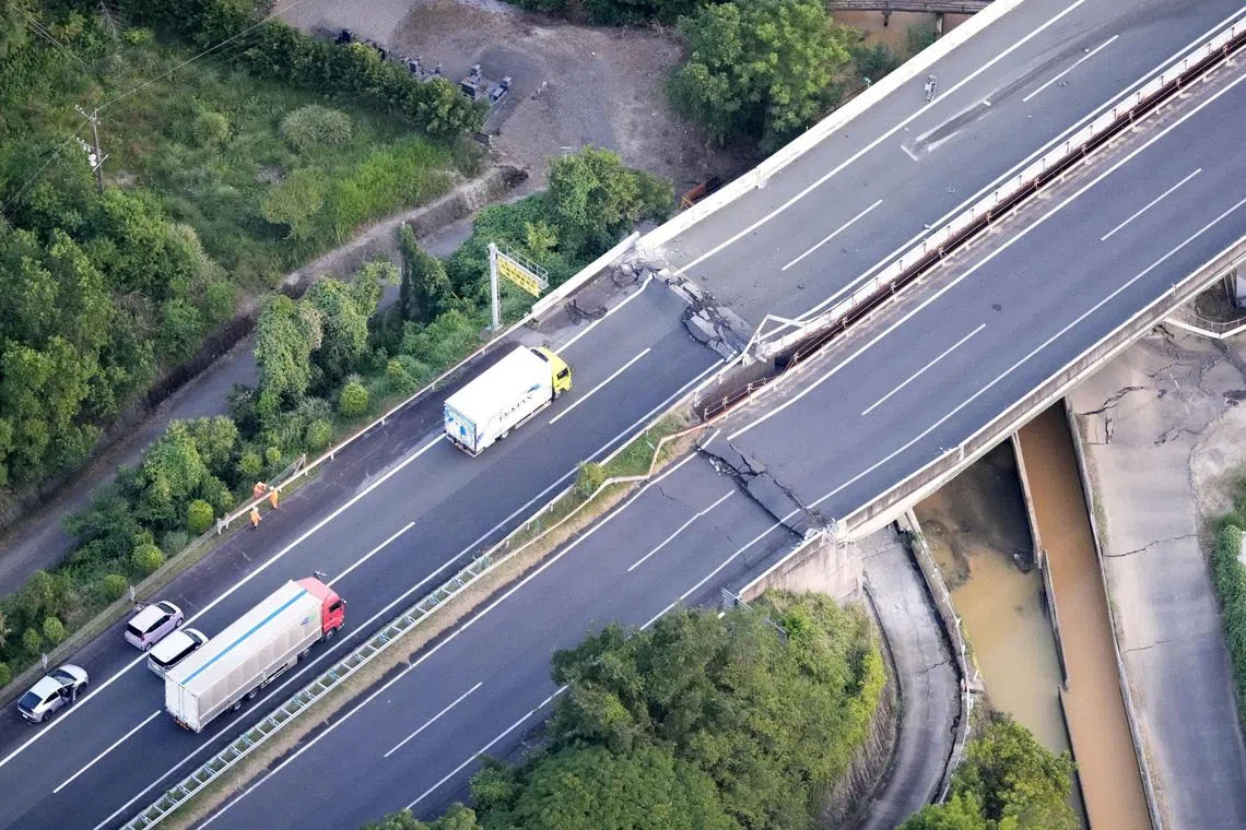 An aerial view shows the damaged Kyushu Expressway after an earthquake on July 28.