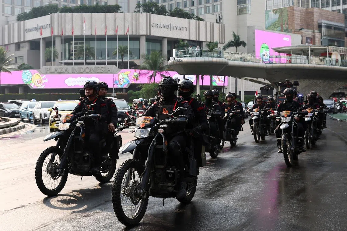 Riot police drive past the city center during a patrol amid the widespread anti-government protests and rioting over issues such as extra pay for parliamentarians and housing allowances led by student group that resulted into riots rocked Southeast Asia's largest economy, in Jakarta, Indonesia, August 31, 2025. REUTERS/Willy Kurniawan