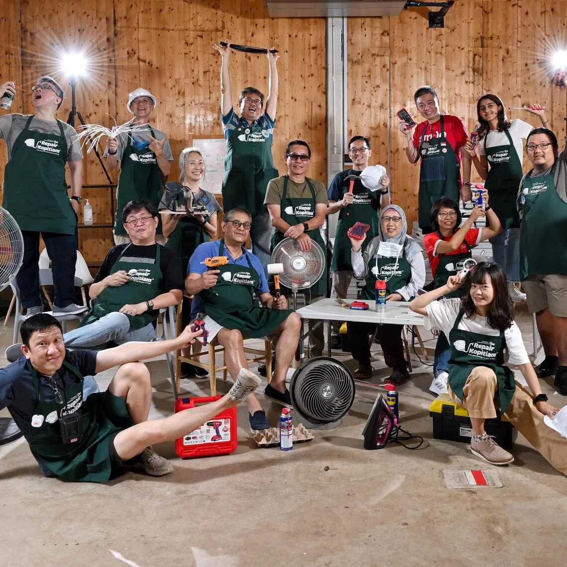 Repair Kopitiam coaches and volunteers posing with the tools of their trade.