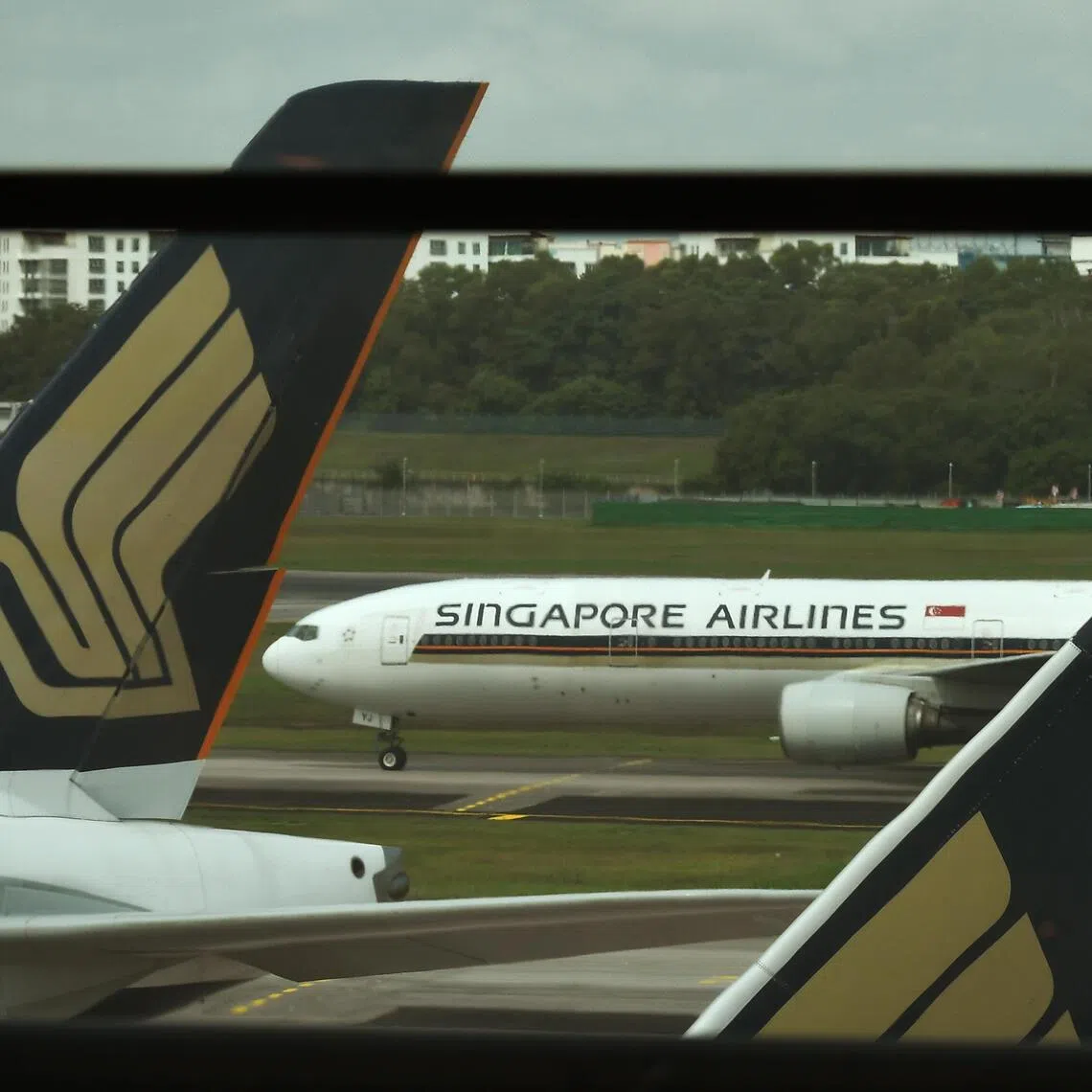 Singapore Airlines (SIA)'s first half net profits were dragged by its share of losses from Air India. 