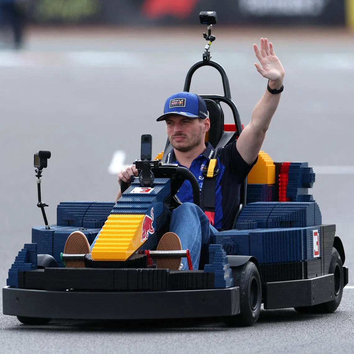 Formula One F1 - British Grand Prix - Silverstone Circuit, Silverstone, Britain - July 5, 2026 Red Bull's Max Verstappen in a car made of Lego blocks ahead of the race REUTERS/Andrew Boyers