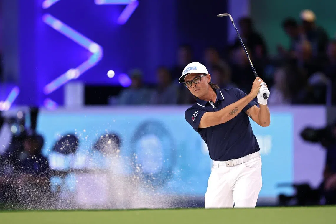 Jan 7, 2025; Palm Beach Gardens, Florida,   Rickie Fowler of New York Golf Club plays a shot from a bunker during their TGL presented by SoFi match against the New York Golf Club at SoFi Center. Mandatory Credit: Handout Photo/ Brennan Asplen/TGL Golf via Imagn Images