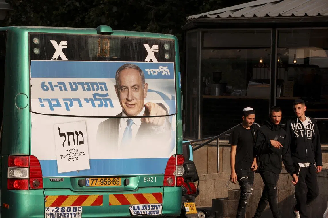 An election campaign poster of former Israeli Prime Minister Benjamin Netanyahu on the back of a bus in Jerusalem on Monday.