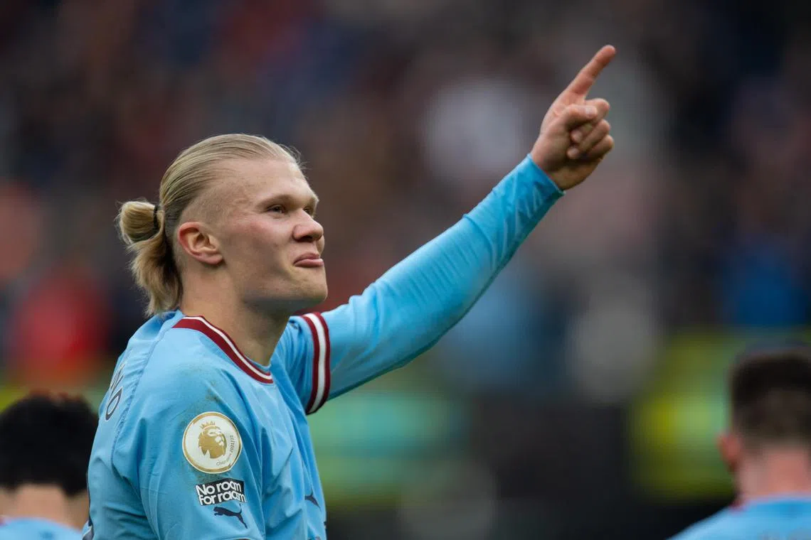 Manchester City's Erling Haaland celebrates after scoring his team's  first goal against Wolves.