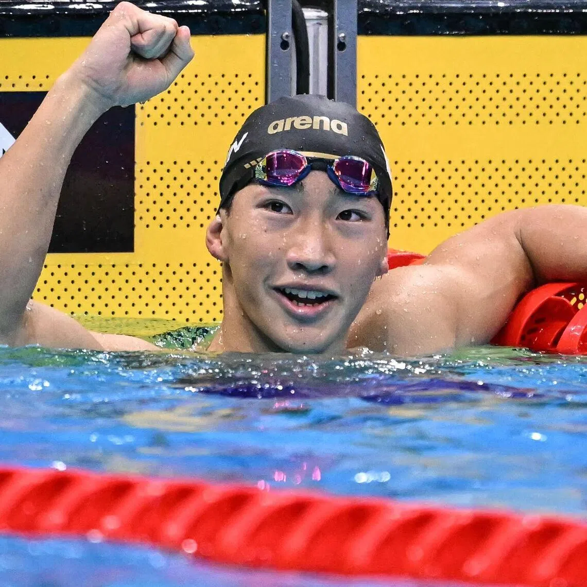 Japan’s Shin Ohashi celebrates after breaking men’s 200m breaststroke world record at the Asian Games.