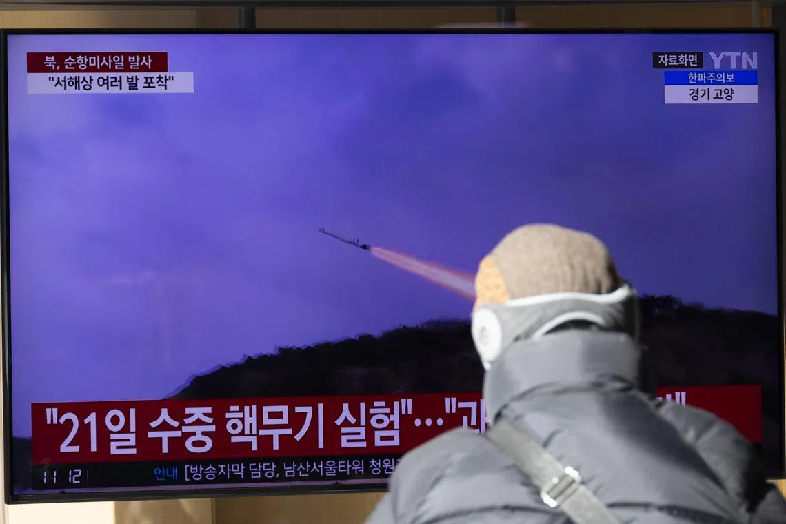 A man watches a television screen broadcasting the news of missiles launched by North Korea at a station in Seoul on Jan 24. 