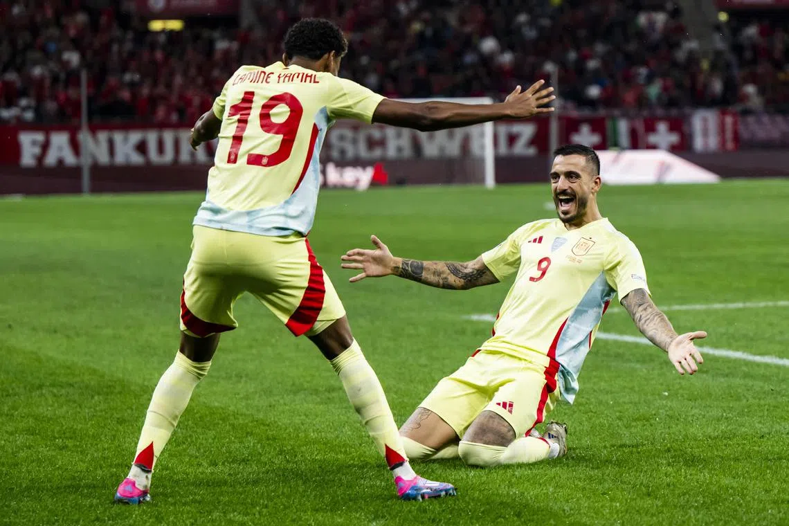 Spain's Joselu celebrating with teammate Lamine Yamal after scoring the opener in the 4-1 Nations League win over Switzerland in Geneva on Sept 8.