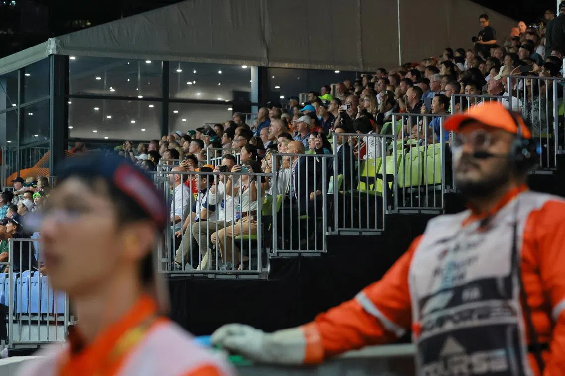 Spectators watching the Formula One Singapore Airlines Singapore Grand Prix at Marina Bay street circuit from the grandstand on Sept 17.