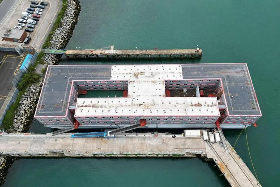An aerial view shows the Bibby Stockholm barge moored at Portland Port, near Poole, Britain, August 7, 2023. REUTERS/Toby Melville
