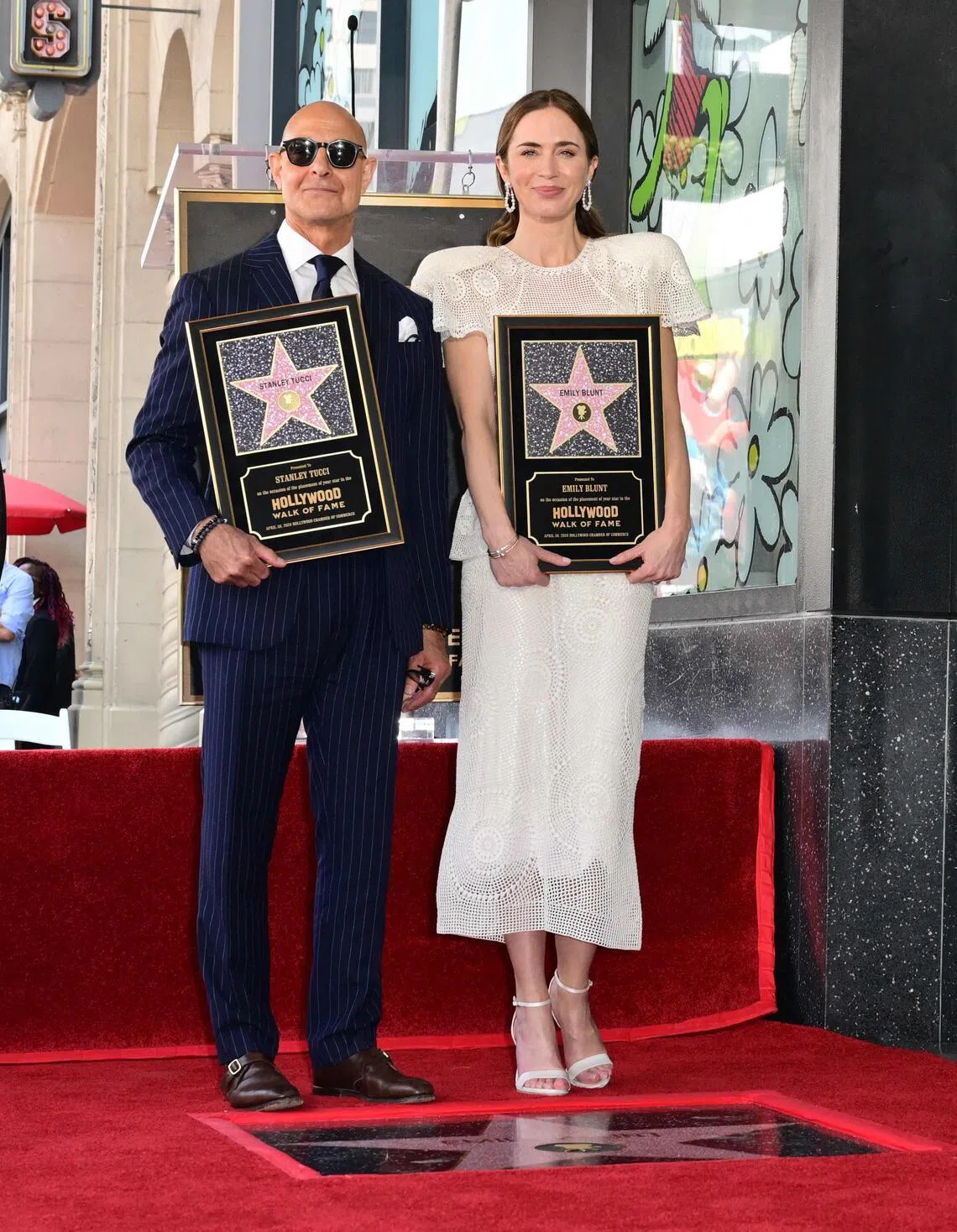 Stanley Tucci (left) and Emily Blunt at the unveiling of their adjoining stars during the Walk of Fame star ceremony in Hollywood, California, on April 30.