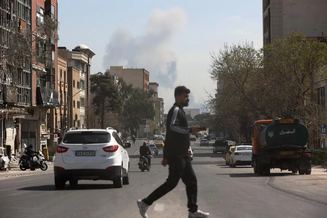Smoke rises following a strike in Tehran, Iran, March 4.  Majid Asgaripour/WANA