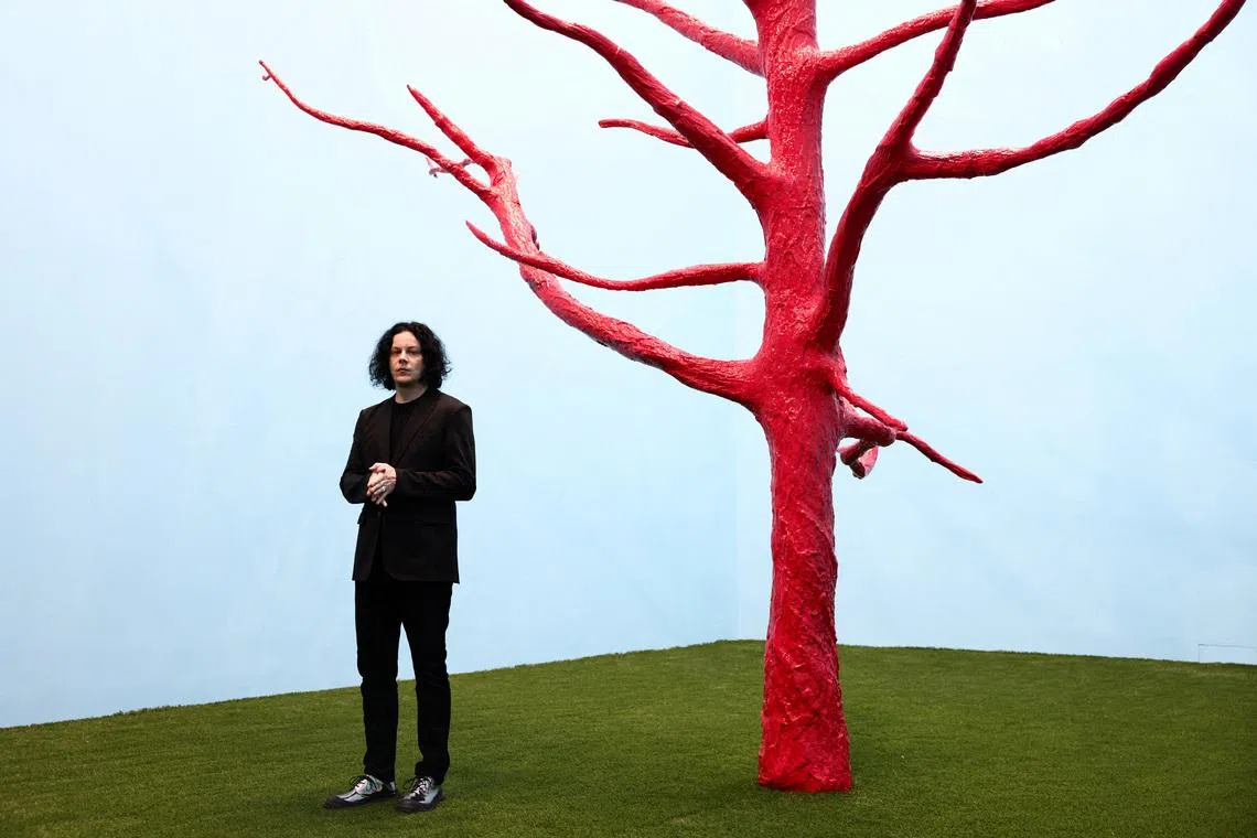 American musician Jack White, guitarist and lead vocalist of the rock duo The White Stripes, posing with 'The Red Tree' (2026) during a photo call launching his "Jack White: These Thoughts May Disappear" exhibition at Newport Street Gallery in London, Britain, on May 28, 2026. 
