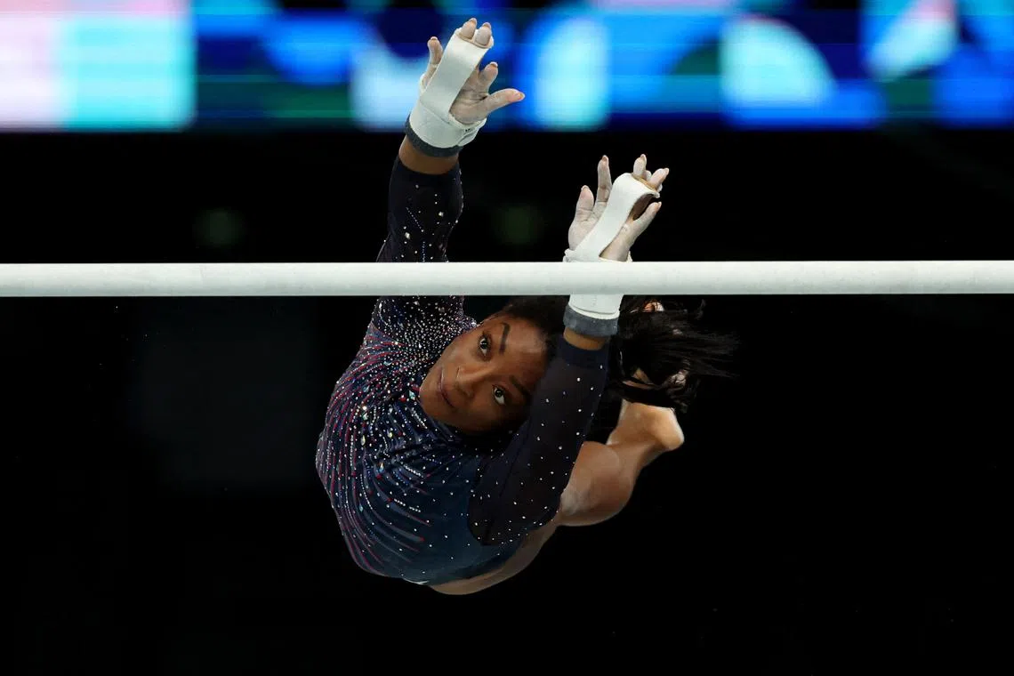 FILE PHOTO: Paris 2024 Olympics - Artistic Gymnastics - Women's Podium Training - Bercy Arena, Paris, France - July 25, 2024. Simone Biles of United States on the uneven bars during training. REUTERS/Amanda Perobelli/File Photo