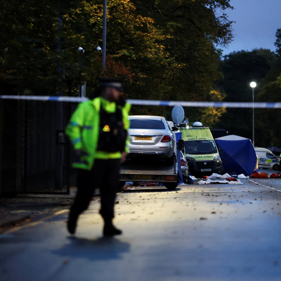 Police officers stand guard at the cordon outside the Manchester synagogue, where multiple people were killed on Yom Kippur in what police have declared a terrorist incident, in north Manchester, Britain, October 3, 2025. REUTERS/Phil Noble