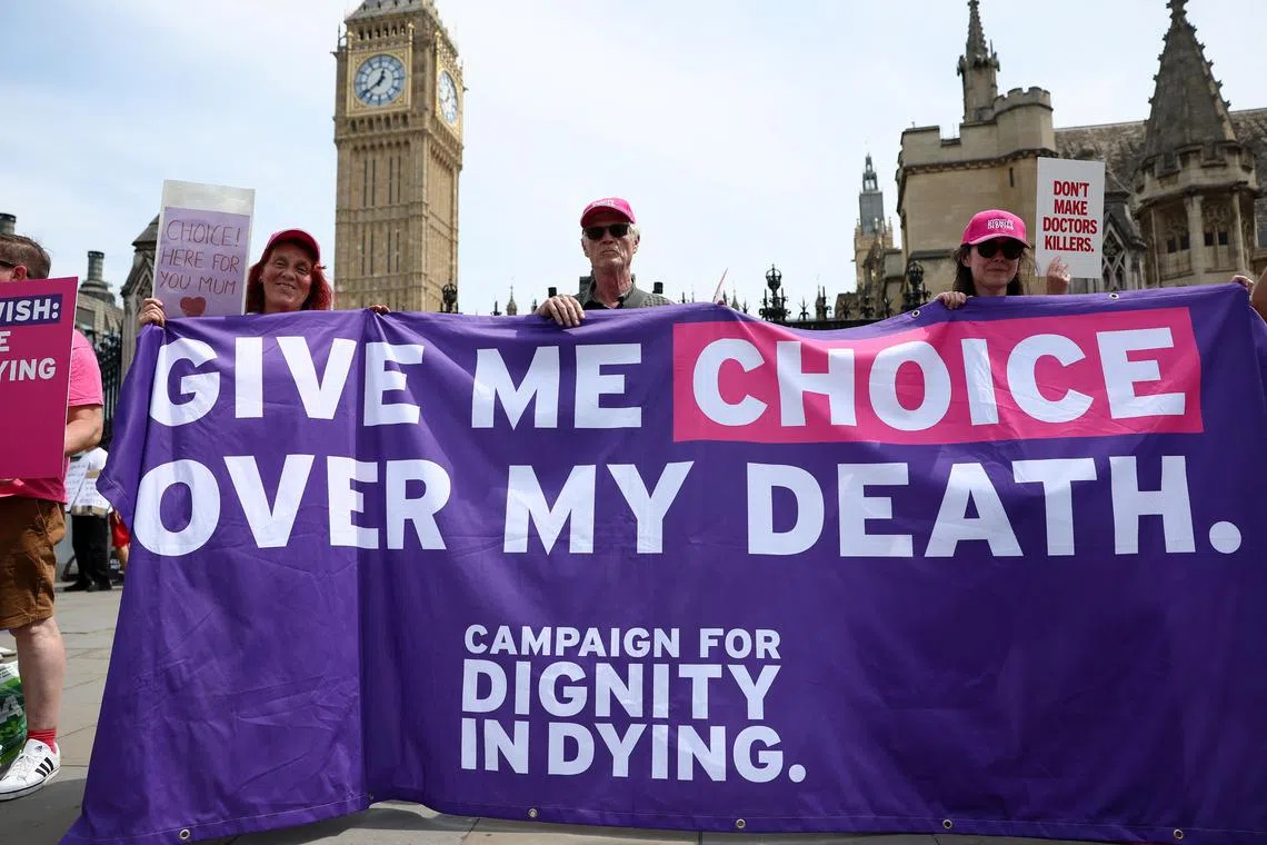 Supporters of the assisted dying law for terminally ill people hold a banner, on the day British lawmakers are preparing to vote on the bill, in London, Britain, June 20, 2025. REUTERS/Isabel Infantes